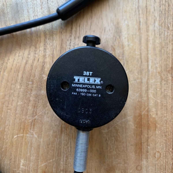 Back side of a Telex 38T handheld microphone for an aircraft cockpit.