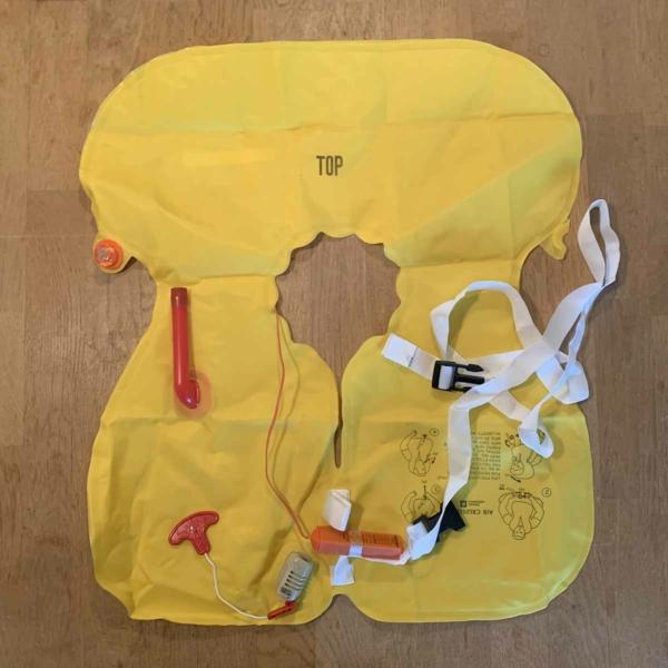 Inflatable life jacket from a passenger aircraft safety demonstration kit.