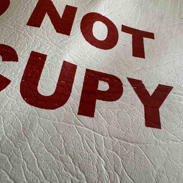 Seat covers 'do not occupy' for sale.
