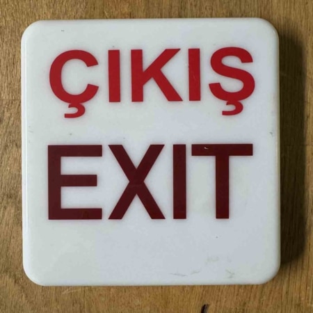 Exit / Cikis sign lens for an aircraft for sale.